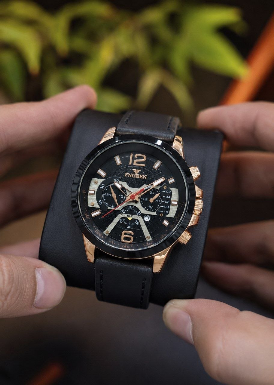 FNGEEN  subset of BIN BOND       ⌚️برند شرکتی مردونه   مقاوم دربرابر آب  دارای روز شمار طرح کرنوگراف  بند چرمی  شب نما  رنگ ثابت  قفل کمربندی  موتور کوارتز