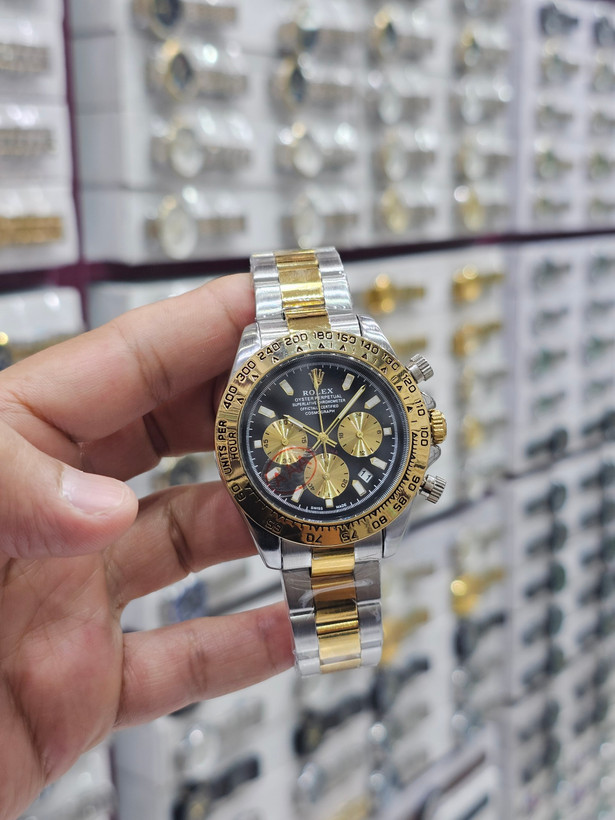 ROLEX Cosmogrqph Daytona ✨✨⌚️شکوه طلا روی مچ شما... 🔻مردونه رولکس دیتونا کرنوگراف قفل رولکسی( دو قفل ) بنداستیل دارای روزشمار شيشه کریستال بزل چرخان